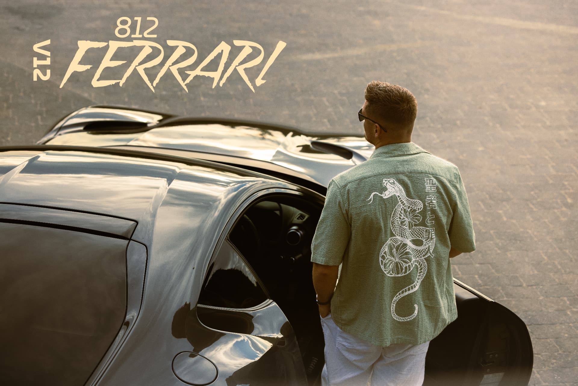 Man stepping out of a Ferrari 812 in a mint-green shirt