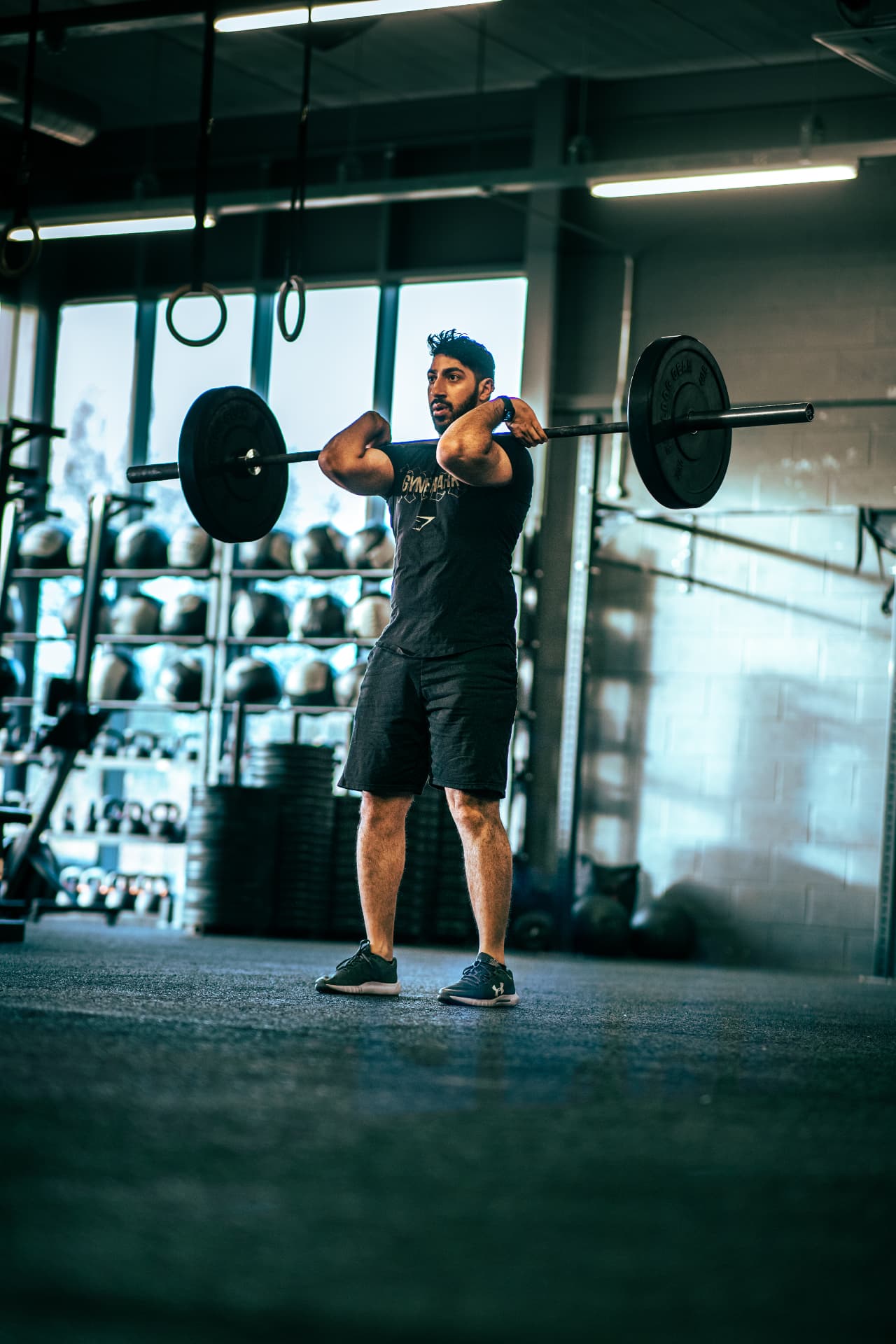 Athlete lifting a barbell during a gym brand shoot